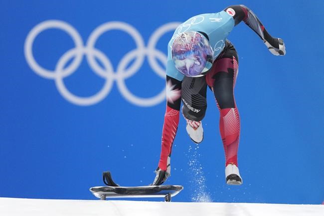 Mirela Rahneva of Canada starts during the women's skeleton training run at the 2022 Winter Olympics, Tuesday, Feb. 8, 2022, in the Yanqing district of Beijing. Citing systemic issues within the national sport organization, some of Canada's top bobsled and skeleton athletes are calling for the resignation of the program's top staff members. THE CANADIAN PRESS/AP/Pavel Golovkin