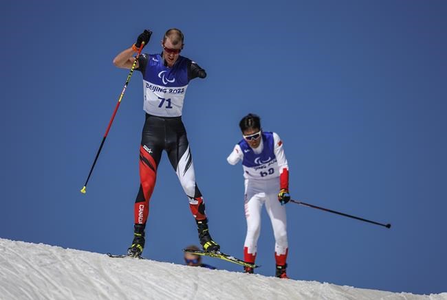 Mark Arendz of Canada (LW6) competes in the men's Middle Distance Standing Para Biathlon at the Zhangjiakou National Biathlon Centre during the Beijing Winter Paralympic Games in Zhangjiakou, China, Tuesday, March 8, 2022. Arendz, a Hartsville, P.E.I. native, won a gold medal in the men's middle distance standing para biathlon event at the 2022 Beijing Paralympics. THE CANADIAN PRESS/AP-HO-Olympic Information Services, Simon Bruty, *MANDATORY CREDIT*