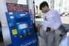 Jason Ventura prepares to pump gas into his vehicle, Friday, March 4, 2022, in Boston. Gasoline prices are setting a new record, and they're likely to go higher in the coming weeks. The national average topped $4.17 a gallon on Tuesday, March 8, according to auto club AAA. (AP Photo/Michael Dwyer)