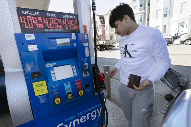 Jason Ventura prepares to pump gas into his vehicle, Friday, March 4, 2022, in Boston. Gasoline prices are setting a new record, and they're likely to go higher in the coming weeks. The national average topped $4.17 a gallon on Tuesday, March 8, according to auto club AAA. (AP Photo/Michael Dwyer)