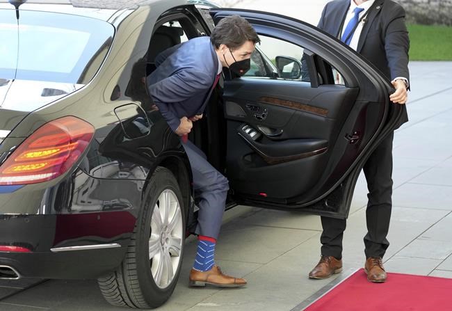 Canadian Prime Minister Justin Trudeau leves his car as he arrives for a meeting with German Chancellor Olaf Scholz at the chancellery in Berlin, Germany, Wednesday, March 9, 2022. (AP Photo/Michael Sohn)