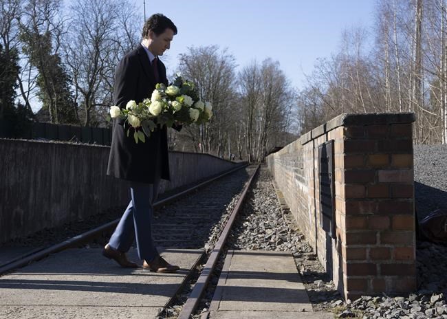 Canadian Prime Minister Justin Trudeau lays flowers at the Platform 17 memorial at the Grunewald S-Bahn train station in Berlin, Germany, Wednesday, March 9, 2022. The station was used to deport Jews from Berlin during the holocaust. THE CANADIAN PRESS/Adrian Wyld