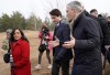 The head of the NATO military alliance says he welcomes Prime Minister Justin Trudeau's assertion that Canada will be looking at increasing its military spending following Russia's invasion of Ukraine. NATO Secretary General Jens Stoltenberg, right, Canadian Prime Minister Justin Trudeau, center, and Canadian Minister of National Defense Anita Anand talk to each other during their visit to Adazi Military base in Kadaga, Latvia, Tuesday, March. 8, 2022. (AP Photo/Roman Koksarov)