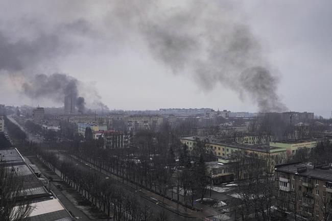 Smoke rises after shelling in Mariupol, Ukraine, Wednesday, March 9, 2022. (AP Photo/Evgeniy Maloletka)