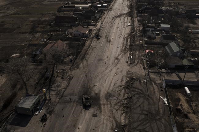 Destroyed Russian tanks are seen on a main road after battles near Brovary, north of Kyiv, Ukraine, Thursday, March 10, 2022. (AP Photo/Felipe Dana)
