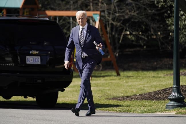 President Joe Biden walks to board Marine One on the South Lawn of the White House, Tuesday, March 8, 2022, for a short trip to Andrews Air Force Base, Md., and then on to Philadelphia to speak to the House Democratic Caucus Issues Conference. (AP Photo/Andrew Harnik)