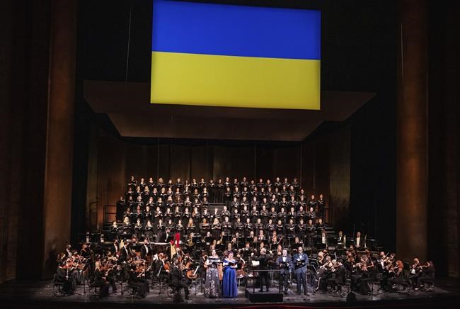 This image released by the Metropolitan Opera shows the Met Orchestra and Chorus in
