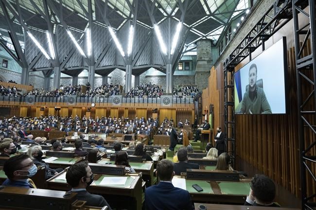 Canadian Parliamentarians and invited guests listen to Ukrainian President Volodymyr Zelenskyy address the Canadian parliament, Tuesday, March 15, 2022 in Ottawa. THE CANADIAN PRESS/Adrian Wyld