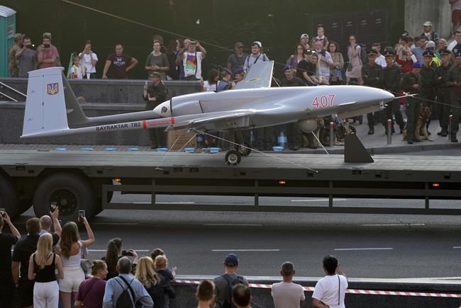 FILE - A Turkish-made Bayraktar TB2 drone is displayed during a rehearsal of a military parade dedicated to Independence Day in Kyiv, Ukraine, Aug. 20, 2021. The drones, which carry lightweight, laser-guided bombs, have carried out unexpectedly successful attacks in the early stages of Ukraine's conflict with Russia. (AP Photo/Efrem Lukatsky, File)