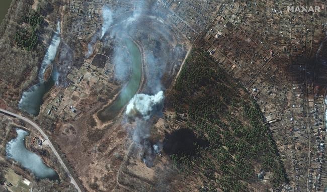 This satellite image provided by Maxar Technologies on Friday, March 18, 2022 shows artillery impacts and burning fields in Chernihiv, Ukraine. (Satellite image ©2022 Maxar Technologies via AP)