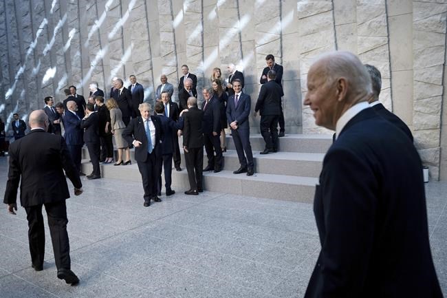 President Joe Biden arrives for a family photograph at NATO Headquarters in Brussels, Thursday, March 24, 2022. (Brendan Smialowski, Pool via AP)