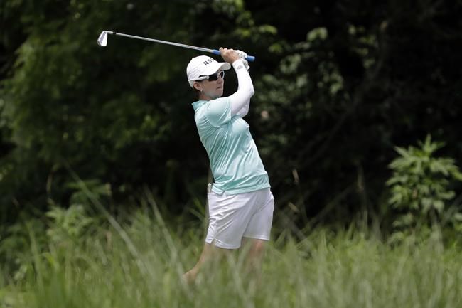 FILE - Karrie Webb, of Australia, watches her tee shot in the 17th hole during a practice round for the KPMG Women's PGA Championship golf tournament at Kemper Lakes Golf Course in Lake Zurich, Ill., on June 27, 2018. Seven-time LPGA major winner Karrie Webb has been nominated, Friday March 24, 2022, to captain Australia's golfers at the 2024 Paris Olympics. (AP Photo/Nam Y. Huh, File)