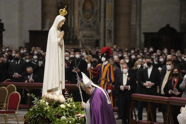 Pope Francis presides over a special prayer in St. Peter's Basilica at the Vatican, Friday, March 25, 2022. Francis is presiding over a special prayer for Ukraine that harks back to a century-old apocalyptic prophesy about peace and Russia that was sparked by purported visions of the Virgin Mary to three peasant children in Fatima, Portugal in 1917. (AP Photo/Gregorio Borgia)