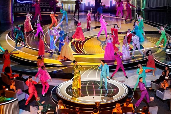 Becky G, center left, and Luis Fonsi, center right, perform
