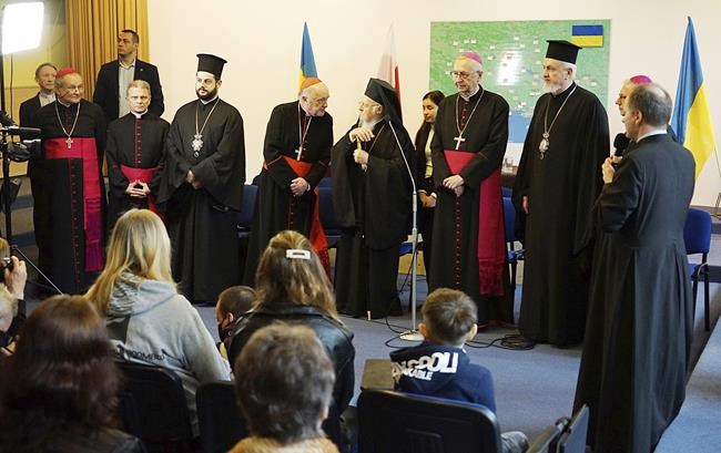 The spiritual leader of the world's Orthodox Christians, Ecumenical Patriarch Bartholomew I, Polish Archbishop Stanisław Gądecki, the head of the Polish Bishops' Conference, and other clergy meet with Ukrainian refugees in Warsaw, Poland, March 29, 2022. Bartholomew denounced Russia's invasion of Ukraine as an
