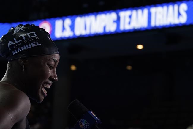 Simone Manuel reacts after the women's 50 freestyle during wave 2 of the U.S. Olympic Swim Trials on June 20, 2021, in Omaha, Neb. The next U.S. Olympic swimming team will be determined in a football stadium. USA Swimming announced Tuesday, March 29, 2022 that its trials for the 2024 Paris Games will be held at Lucas Oil Stadium, the massive home of the NFL's Indianapolis Colts. (AP Photo/Charlie Neibergall, file)