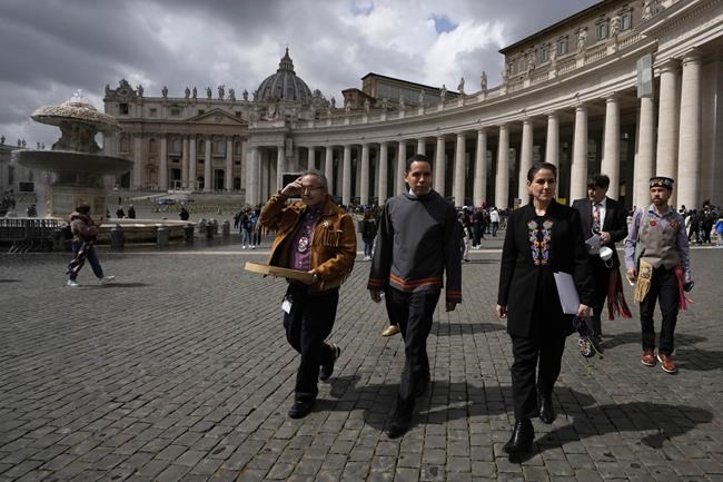From left, Gerald Antoine, First Nations NWT Regional Chief, Natan Obed, President of Inuit Tapiriit Kanatami delegation, and Cassidy Caron, President of the Metis community, walk in St. Peter's Square, at the Vatican, after their meeting with Pope Francis, Friday, April 1, 2022. Pope Francis on Friday made a historic apology to Indigenous Peoples for the