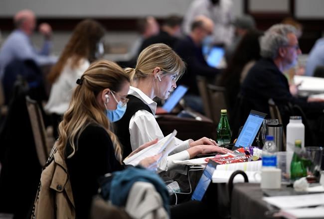 Journalists work in the media lockup, ahead of the tabling of the federal budget, in Ottawa, on Thursday, April 7, 2022. THE CANADIAN PRESS/Justin Tang