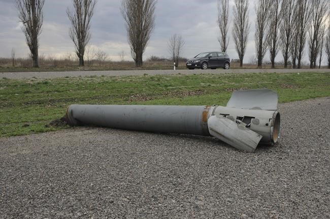 A part of a missile lies next to a road near the city of Chuhuiv, Kharkiv region, Ukraine, Friday, April 8, 2022. (AP Photo/Andrew Marienko)