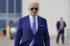 President Joe Biden walks to speak to reporters before boarding Air Force One at Des Moines International Airport, in Des Moines Iowa, Tuesday, April 12, 2022, en route to Washington. Biden said that Russia's war in Ukraine amounted to a 