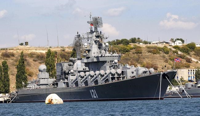 FILE - The Russian missile cruiser Moskva, the flagship of Russia's Black Sea Fleet is seen anchored in the Black Sea port of Sevastopol, on Sept. 11, 2008. The Russian Defense Ministry confirmed the ship was damaged Wednesday, April 13, 2022, but not that it was hit by Ukraine. The Ministry says ammunition on board detonated as a result of a fire whose causes