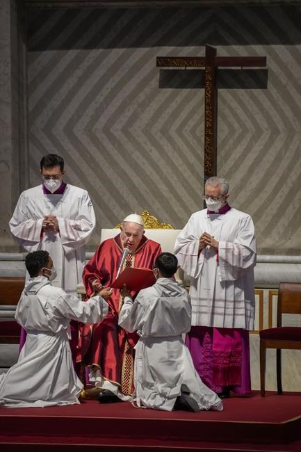 Pope Francis presides over the 'In passione Domini' (in the passion of the Lord) Good Friday mass in St. Peter's Basilica at the Vatican, Friday, April 15, 2022. Usually at the Good Friday basilica service at the Vatican, the pontiff would prostrate himself in prayer. But this time Francis, hobbled by pain for weeks, didn't do so. (AP Photo/Andrew Medichini)