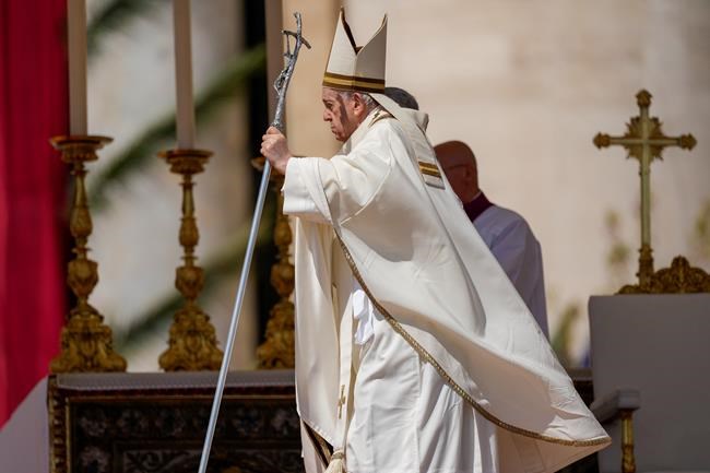 Pope Francis leaves at the end of the Catholic Easter Sunday mass he led in St. Peter's Square at the Vatican, Sunday, April 17, 2022. For many Christians, this weekend marks the first time in three years they will gather in person to celebrate Easter Sunday. (AP Photo/Alessandra Tarantino)