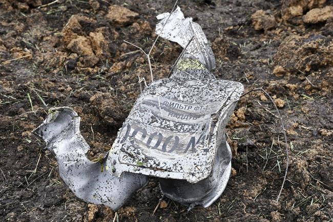A part of a missile with a sign in Russian reading