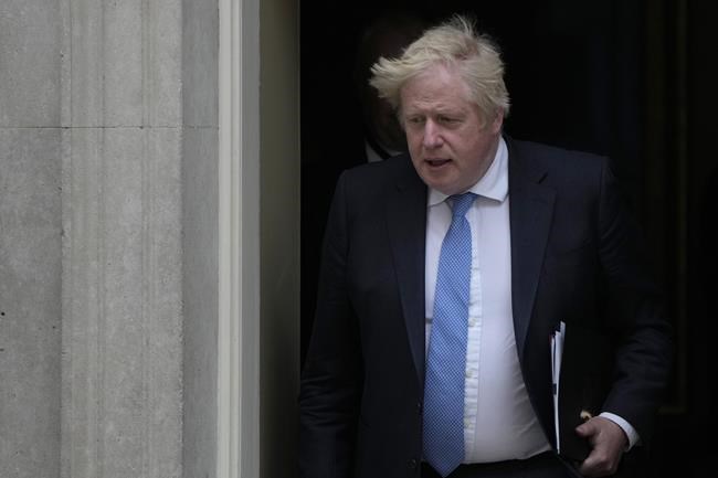 Britain's Prime Minister Boris Johnson leaves 10 Downing Street for the House of Commons to make a statement about Downing Street parties during the coronavirus lockdowns in London, Tuesday, April 19, 2022. (AP Photo/Alastair Grant)