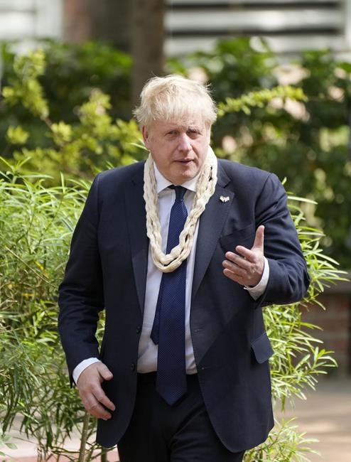 British Prime Minister Boris Johnson visits Gandhi Ashram, the home of Indian freedom fighter Mahatma Gandhi, in Ahmedabad, India, Thursday, April 21, 2022. (AP Photo/Ajit Solanki)