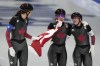 Team Canada, with Isabelle Weidemann left, Valerie Maltais centre and Ivanie Blondin, react after wining the gold medal and setting an Olympic record in the speedskating women's team pursuit finals at the 2022 Winter Olympics, Tuesday, Feb. 15, 2022, in Beijing. THE CANADIAN PRESS/AP/Ashley Landis