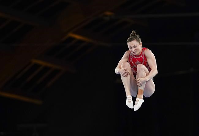 Canada's Rosie MacLennan competes in the women's trampoline gymnastics qualification during the Tokyo Summer Olympic Games, in Tokyo, Friday, July 30, 2021. Canada's top athletes are willing to repair breaches in trust with those who manage them, say their leaders, but the question is how. THE CANADIAN PRESS/Nathan Denette