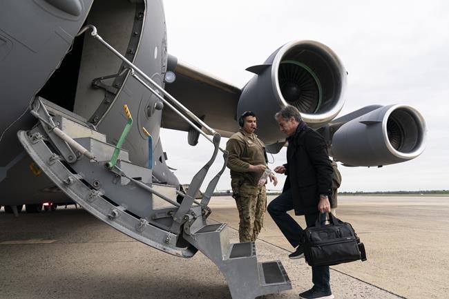 Secretary of State Antony Blinken boards a plane for departure, Saturday, April 23, 2022, at Andrews Air Force Base, Md. The Biden administration has unveiled new U.S. military assistance and a diplomatic surge for Ukraine as Blinken and Defense Secretary Lloyd Austin made a secrecy-shrouded visit to the capital of Kyiv. (AP Photo/Alex Brandon, Pool)