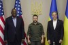In this photo provided by the Ukrainian Presidential Press Office on Monday, April 25, 2022, from left; U.S. Secretary of Defense Lloyd Austin, Ukrainian President Volodymyr Zelenskyy and U.S. Secretary of State Antony Blinken pose for a picture during their meeting Sunday, April 24, 2022, in Kyiv, Ukraine. (Ukrainian Presidential Press Office via AP)