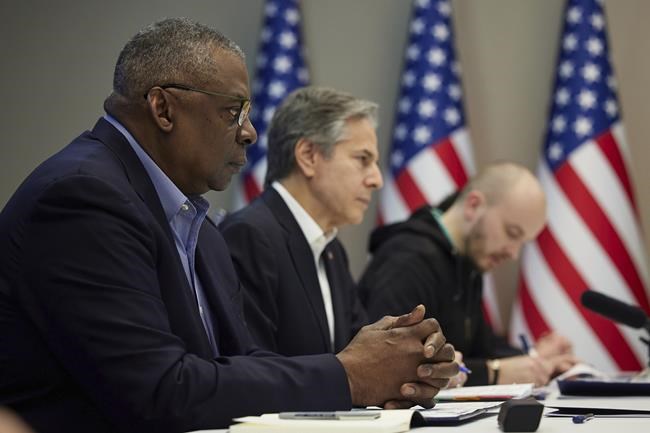 In this photo provided by the Ukrainian Presidential Press Office on Monday, April 25, 2022, U.S. Secretary of Defense Lloyd Austin, left, and Secretary of State Antony Blinken, center, attend their meeting Sunday, April 24, 2022, with Ukrainian President Volodymyr Zelenskyy, not in the picture, in Kyiv, Ukraine. (Ukrainian Presidential Press Office via AP)