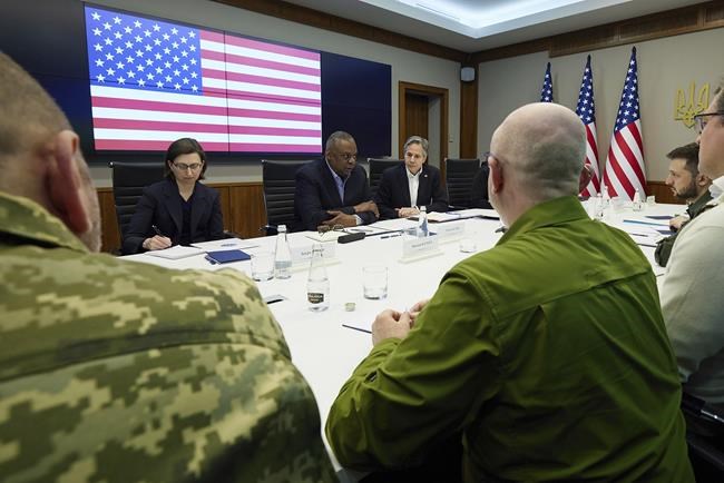 In this photo provided by the Ukrainian Presidential Press Office on Monday, April 25, 2022, U.S. Secretary of Defense Lloyd Austin, center, Secretary of State Antony Blinken, centre right, and Ukrainian President Volodymyr Zelenskyy, second from right, attend their meeting, Sunday, April 24, 2022, in Kyiv, Ukraine. (Ukrainian Presidential Press Office via AP)