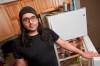 Chanakya Ramdev poses for a photo in the kitchen of his home in Waterloo, Ont. on Tuesday, April 5, 2022. Ramdev has changed where he shops for groceries, he no longer goes to restaurants and he cooks all his meals at home. THE CANADIAN PRESS/ Geoff Robins
