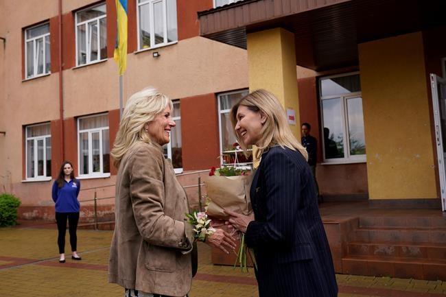 First lady Jill Biden greets Olena Zelenskyy, spouse of Ukrainian's President Volodymyr Zelenskyy, outside of School 6, a public school that has taken in displaced students in Uzhhorod, Ukraine, Sunday, May 8, 2022. (AP Photo/Susan Walsh, Pool)