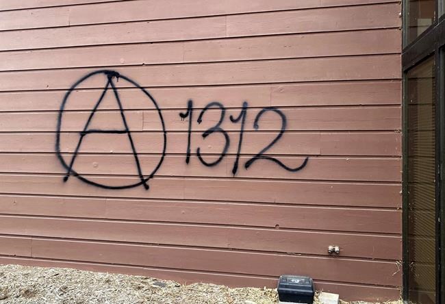 Threatening graffiti which reads