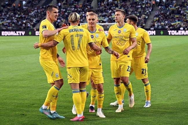 Mykhailo Mudryk from Ukraine celebrates scoring during the soccer match between Borussia Moenchengladbach and Ukraine's national soccer team at Borussia Park, Monchengladbach, Germany, Wednesday May 11, 2022. (Federico Gambarini/dpa via AP)