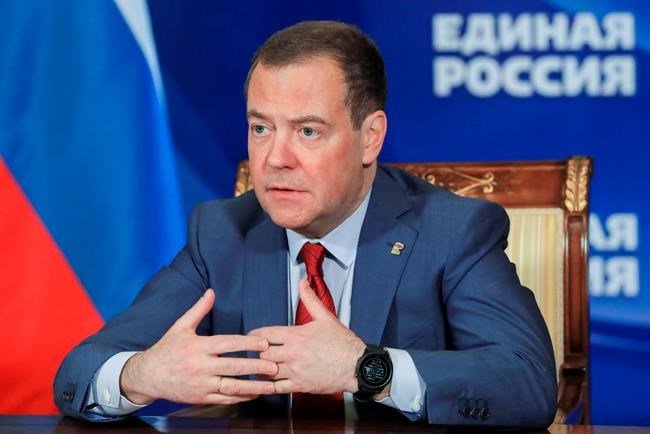 FILE - Russian Security Council Deputy Chairman and the head of the United Russia party Dmitry Medvedev chairs a meeting on saving businesses and jobs in foreign companies via video link at Gorki state residence, outside Moscow, Russia, on March 16, 2022. Dmitry Medvedev, the deputy head of Russia’s Security Council chaired by President Vladimir Putin, said Thursday, May 12, 2022 that growing Western arms supplies to Ukraine and training for its troops have “increased the probability that an ongoing proxy war will turn into an open and direct conflict between NATO and Russia. (Yekaterina Shtukina, Sputnik, Government Pool Photo via AP)