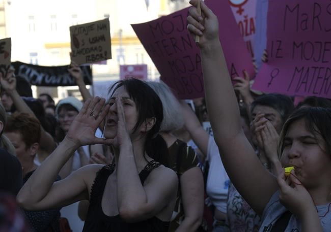 People attend a protest in solidarity with a woman who was denied an abortion despite her fetus having serious health problems, in Zagreb, Croatia, Thursday, May 12, 2022. The case has sparked public outrage and rekindled a years-long debate about abortion in Croatia, a member of the European Union. (AP Photo)