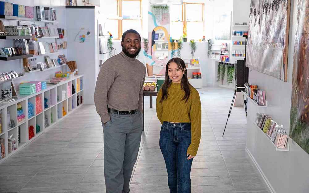 Paul Sogeke, 25, (left) and Sholeth Choquette, 22, are partners in love, art and business at Seduta Art on Arthur Street. (Jessica Lee / Winnipeg Free Press)