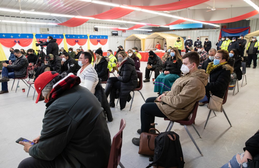 Community members attend the Cross Lake Band Hall on Feb. 16 to honour three children who died days earlier in a house fire. (Jessica Lee / Winnipeg Free Press)