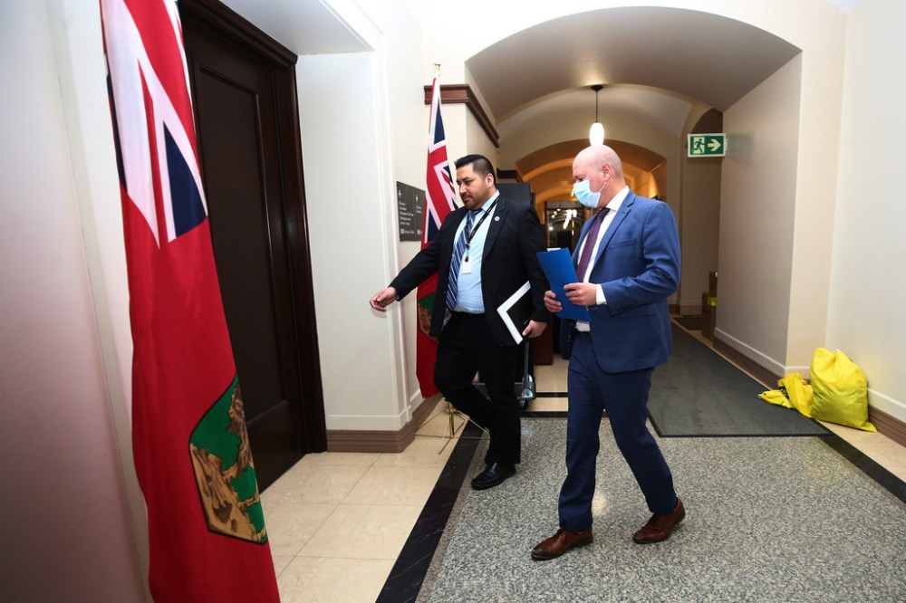 Dr. Brent Roussin, chief provincial public health officer, makes his way Thursday to his first press briefing since restrictions were dropped. (Mike Deal / Winnipeg Free Press)