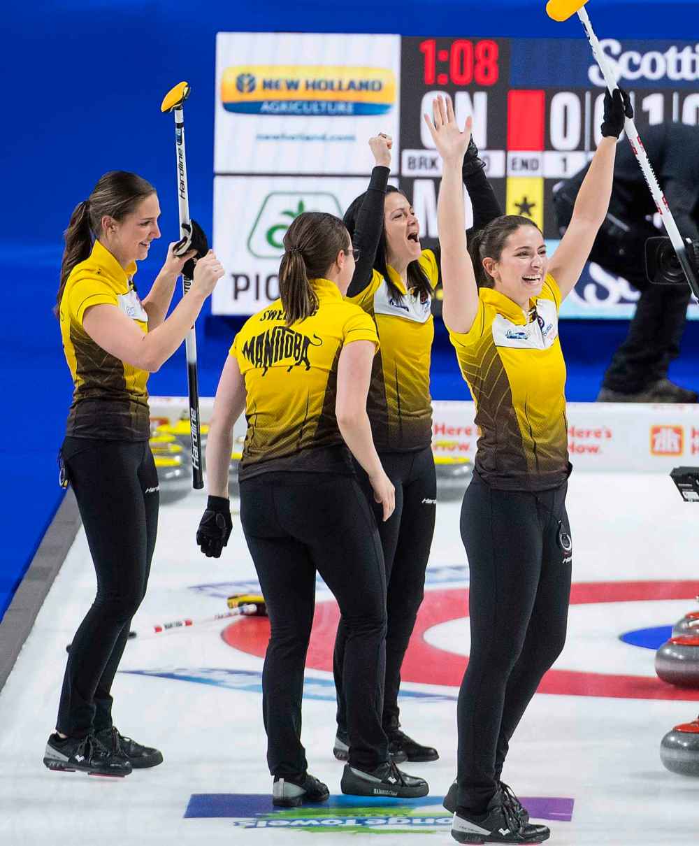 Team Manitoba lead, Briane Meilleur, left to right, third Val Sweeting, skip Kerri Einarson and second Shannon Birchard celebrate after defeating Team Ontario to win the Scotties Tournament of Hearts. (Jonathan Hayward / The Canadian Press)