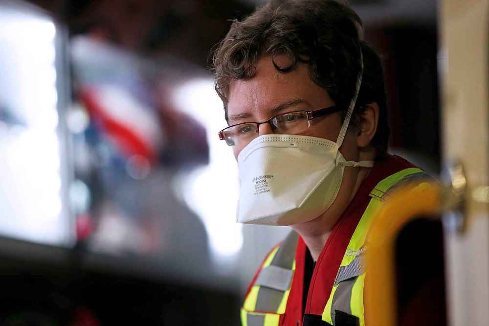 JOHN WOODS / WINNIPEG FREE PRESS
Salvation Army (SA) cadet Kathryn Dueck gets masked before heading out to feed and support people as they drive around in their Extreme Environment Response Vehicle in downtown Winnipeg Saturday, April 4, 2020.
Reporter: Thorpe