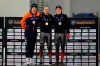 First-place finisher Ted-Jan Bloemen, center, of Canada, shares the podium with second-place Sven Kramer, left, of the Netherlands, and third-place Graeme Fish, right, of Canada, following the men's 5,000 meters at the world single distances speedskating championships Thursday, Feb. 13, 2020, in Kearns, Utah. (AP Photo/Rick Bowmer)