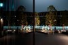 The Olympic rings are reflected on the facade of Japan Olympic Museum Monday, March 30, 2020, in Tokyo. The Tokyo Olympics will open next year in the same time slot scheduled for this year's games. Tokyo organizers said Monday the opening ceremony will take place on July 23, 2021. (AP Photo/Jae C. Hong)