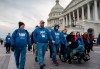 As the impeachment trial of President Donald Trump is conducted inside the Senate, activists attending the March for Life anti-abortion rally visit the Capitol in Washington, Thursday, Jan. 23, 2020. The White House says President Trump will become the first president to attend the annual gathering on Friday. (AP Photo/J. Scott Applewhite)